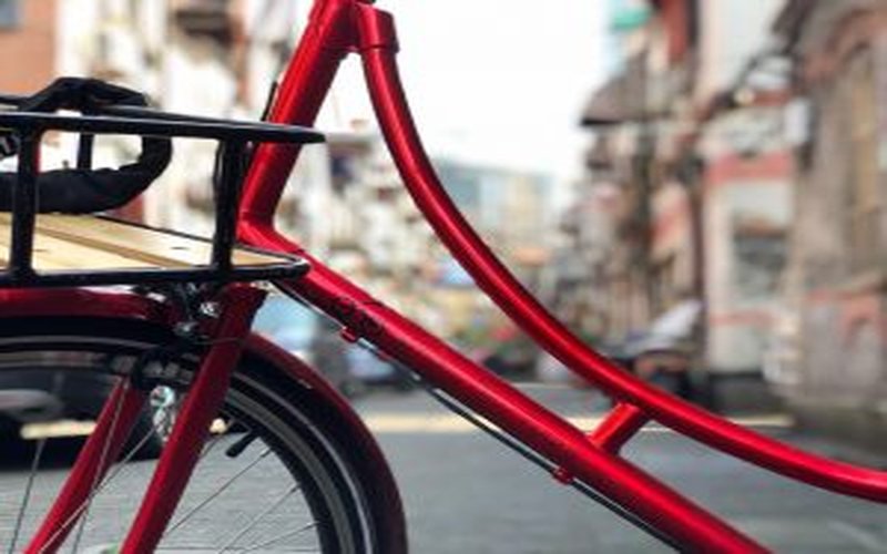 Red vintage bike on Shanghai street — French Concession Tour